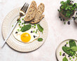 Healthy egg breakfast with spinach and microgreens