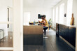 © Flamingo Images - Young mom taking care of her daughter while working from home.