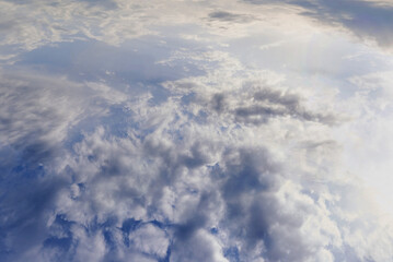 Wall Mural - Aerial view of the sky in the clouds in the sunshine.