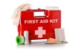 © Shawn Hempel - Red first aid medical kit box with scissors, bandage, tape and gloves standing over white