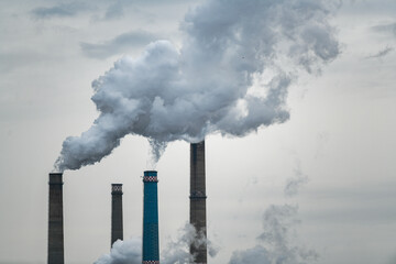 Air pollution concept - smoke from chimneys of power plant