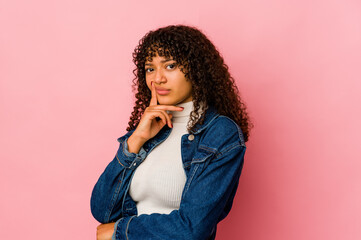 Wall Mural - Young african american afro woman isolated unhappy looking in camera with sarcastic expression.