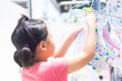 © MIA Studio - kid helper at home.Laundry in summer morning at home.Asian girl child line dry the clothes with her mother.kid activity during lockdown covid19 coronavirus. hygiene clean and dry cloth.responsibility.