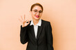 © Asier - Young skinny caucasian business woman isolated cheerful and confident showing ok gesture.