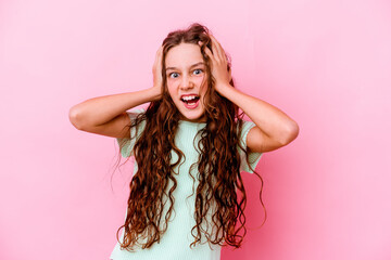 Wall Mural - Little caucasian girl isolated on pink background covering ears with hands trying not to hear too loud sound.