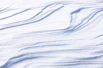 Wall Mural - beautiful outdoor scene of white nature, light slope with smooth curve layers of soft snow surface o