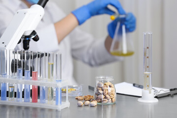 Wall Mural - pistachios on table and scientist proceeding quality control in laboratory