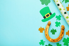 Green Clovers And Gold Horseshoe On Blue Background For St. Patrick's Day Holiday.