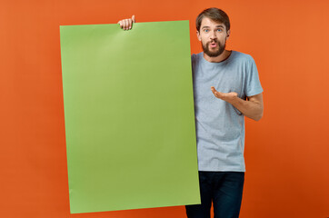 emotional man holding mocap poster advertising communication in hand