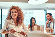 © Afshar Tetyana - Female general manager sitting in conference room and looking at camera