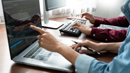 Canvas Print - Team of Programmer working to find solution to problem and coding technologies in a software developing company office.