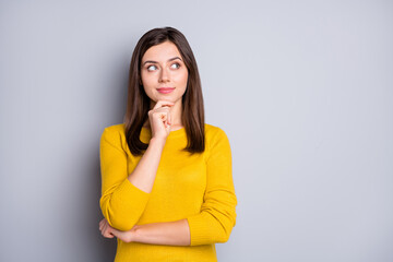 Wall Mural - Photo of young attractive thoughtful minded pretty lovely girl thinking look copyspace isolated on grey color background