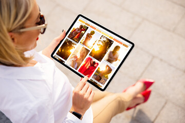 Wall Mural - Woman browsing pinned photos online for ideas and inspiration on beautiful fashion photos.
