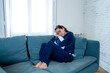 © SB Arts Media - Young sad woman suffering from depression feeling lonely and hopeless isolated at home
