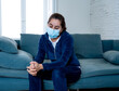 © SB Arts Media - Lonely woman suffering from depression at home during coronavirus lockdown and social distancing