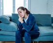 © SB Arts Media - Young sad woman suffering from depression feeling lonely and hopeless isolated at home