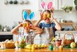 © JenkoAtaman - Happy easter! funny children   with ears hare playing and getting ready for  holiday