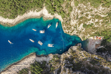 Wall Mural - Aerial overhead drone shot of Stiniva covert cove beach in Adriatic sea on Vis Island in Croatia in summer
