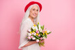 © deagreez - Profile side view portrait of attractive cheerful grey-haired woman holding floral bunch isolated over pink pastel color background
