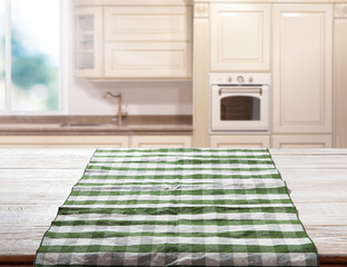 Napkin on wooden desk perspective. Kitchen background.