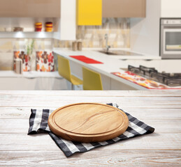 Napkin and board for pizza on wooden desk. Kitchen background.