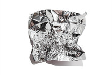 White Shiny Aluminum Foil Wrap Without Chocolate Candy On A White Background. Texture Of Used Crumpled Aluminium Food Foil.
