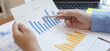 © Kantamard - Financial businessmen analyze the graph of the company's performance to create profits and growth, Market research reports and income statistics, Financial and Accounting concept.