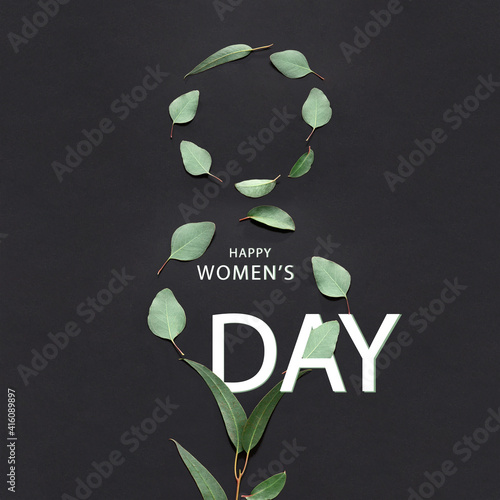 Happy holdays. Composition of leaves in shape of number 8 over black background.. Greeting card, postcard for Women's Day March 8th. Concept of greetings, celebrations. Copy space for design, ad.