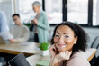 © LIGHTFIELD STUDIOS - Smiling african american businesswoman with vitiligo looking at camera