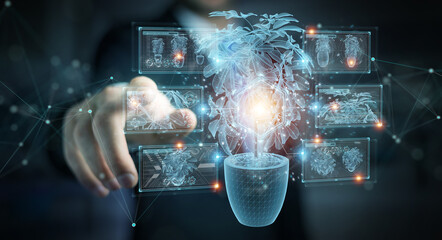 Leinwandbilder - Man holding and touching holographic projection of a plant with digital analysis 3D rendering