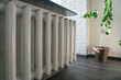 Cast iron heating radiator hanging in a room, close up, selective focus