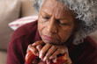 © Wavebreak Media - Close up of thoughtful african american senior woman sleeping while holding walking stick at home