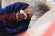 © Wavebreak Media - Sick african american senior woman lying on the couch