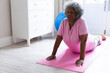 © Wavebreak Media - African american senior woman practicing yoga and meditating at home