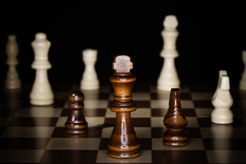 Wooden chess board and pieces.