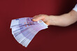 © kittyfly - male hands hold paper 500 euro banknotes in his hands, counting a bundle of money, concept of cash, payments, savings