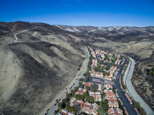A Charred Hillside Where A Wildfire Was Stopped Short Of A Neighborhood Below