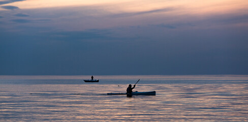 Wall Mural - Boat in the sea with dark clouds