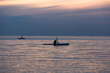 Wall Mural - Boat in the sea with dark clouds