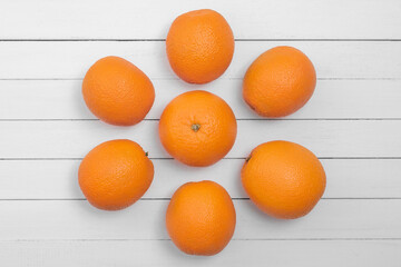 oranges on white wooden background