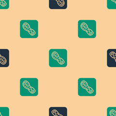 Wall Mural - Green and black Human footprints shoes icon isolated seamless pattern on beige background. Shoes sole. Vector.