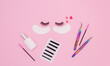 Tools and patches for eyelash extensions and artificial eyelashes on a pink background. Tools for the lashmaker. The view from the top.