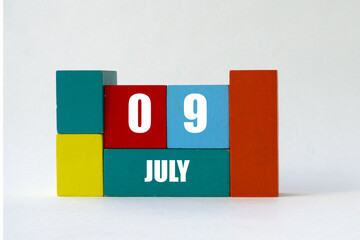 Day of month. Cube Calendar on multi-colored cubes on white background