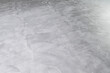 © Formatoriginal - Background of Microcement grey floor with defects due to human errors