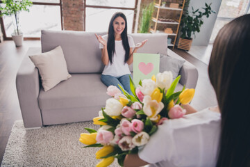 Sticker - Photo of astonished positive lady sitting on couch arms palms applaud girl hold flowers postcard free time indoors