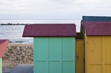 Colored Beach Huts On The Sand In Front Of The Mediterranean Sea On A Winter Day (Pesaro, Italy, Europe)
