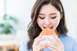 asian woman eat hamburger