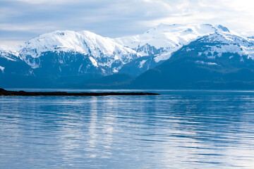 Snow-capped mountains along the coast of southern Alaska