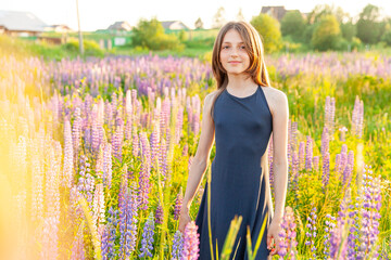happy teenage girl smiling outdoor. beautiful young teen woman resting on summer field with blooming