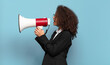 © kues1 - pretty afro teenager business girl with a megaphone